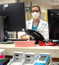 Healthcare worker working on computer.